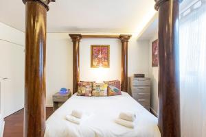 En eller flere senge i et værelse på GuestReady - Fantástico apt em Santa Catarina