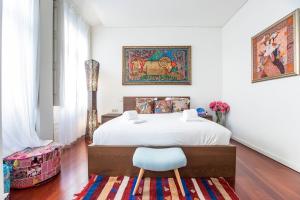 En eller flere senge i et værelse på GuestReady - Fantástico apt em Santa Catarina