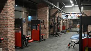 a gym with a bunch of bikes and weights at MİMOZA BUSİNESS PLUS apart in Sanlıurfa