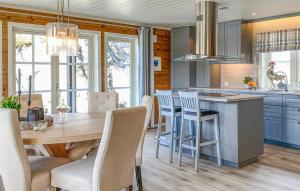 a kitchen with a large wooden table and chairs at Lovely Home In Stryn With House A Panoramic View in Stryn