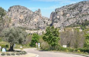 a winding road in front of a mountain at Awesome Home In Moustiers-Sainte-Marie in Moustiers-Sainte-Marie