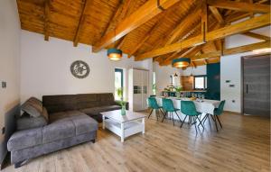 a living room with a couch and a table at Gorgeous Home In Puscine With Sauna in Varaždin