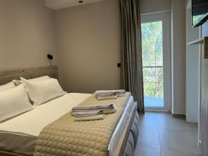 Postel nebo postele na pokoji v ubytování Hotel Kseal