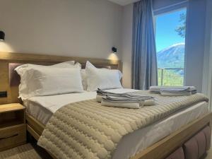 Postel nebo postele na pokoji v ubytování Hotel Kseal