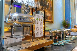 a kitchen with a coffee machine on a counter at Hotel Kinsky Fountain in Prague
