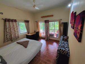 Ένα ή περισσότερα κρεβάτια σε δωμάτιο στο Yellaki Farm Stay