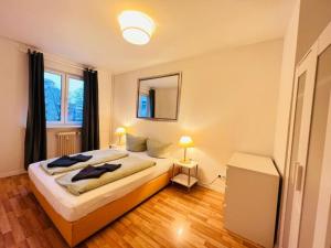 a bedroom with a bed and a mirror on the wall at Central City West 3 in Berlin
