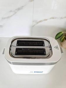 a toaster oven sitting on top of a counter at Villa Mimosa 1, Splendid 4 Bedroom Master Ensuite in Phuket