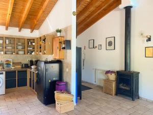 a kitchen with a refrigerator and a stove at Villa Alba in Aljezur