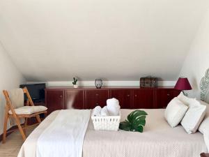 a bedroom with a bed with a basket on it at Betula Pendula - 12601 in Ajo +7 photos
