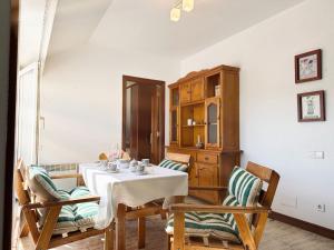 a dining room with a table and two chairs at Betula Pendula - 12601 in Ajo