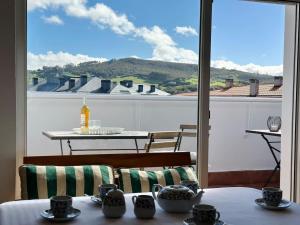 a room with a table and a view of a balcony at Betula Pendula - 12601 in Ajo