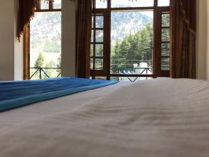 Cama o camas de una habitación en Sanmiro Lodge