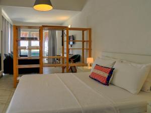 a bedroom with a large bed with a pillow on it at Oza Boutique hotel in Gümüşlük