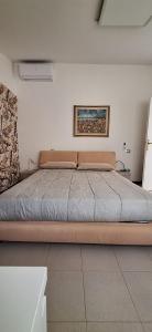 a large bed in a room with at Rifugio collina del Sacro Cuore in Ascoli Piceno