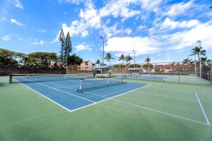 a tennis court with two tennis nets on it at Keauhou Kona Surf & Racket Club Townhouse #3 in Kailua-Kona