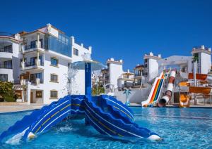 a water slide in a pool in a resort at Sharm Hills Resort in Sharm El Sheikh