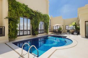 a swimming pool in the middle of a house at George V Casa Branca in Sao Paulo