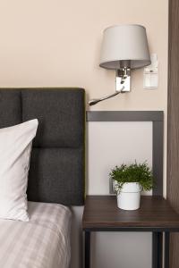 Postel nebo postele na pokoji v ubytování Hotel Impresja