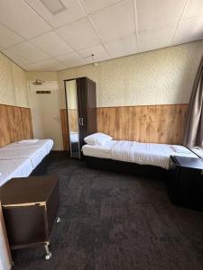 Letto o letti in una camera di Flex-Inn