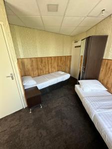 Letto o letti in una camera di Flex-Inn