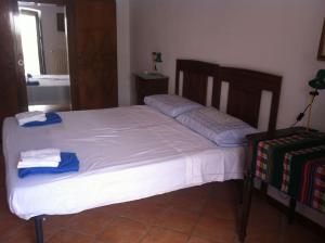 Giường trong phòng chung tại Al borgo dei Principi Pollica