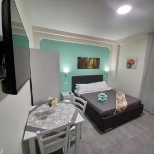Postel nebo postele na pokoji v ubytování ACRONE GUEST HOUSE Centro Città (Locazione Turistica)
