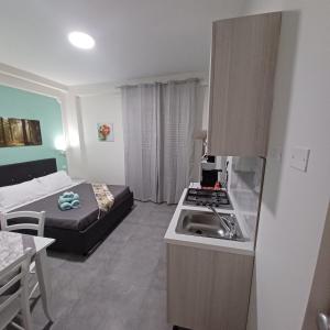 Kuchyň nebo kuchyňský kout v ubytování ACRONE GUEST HOUSE Centro Città (Locazione Turistica)