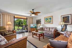a living room with a couch and a table at Keauhou Kona Surf & Racquet Club#7-102 "Honu Hale" in Kailua-Kona
