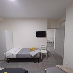 Postel nebo postele na pokoji v ubytování ACRONE GUEST HOUSE Centro Città (Locazione Turistica)