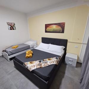 Postel nebo postele na pokoji v ubytování ACRONE GUEST HOUSE Centro Città (Locazione Turistica)