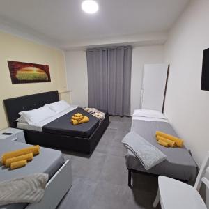 Postel nebo postele na pokoji v ubytování ACRONE GUEST HOUSE Centro Città (Locazione Turistica)