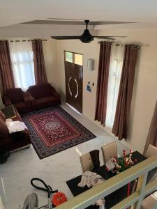 an aerial view of a living room with a couch at Kastana Homestay II in Wakaf Baharu
