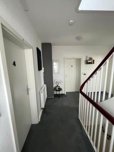 a hallway with a staircase and a stair case at Ferienhaus Cassel in Kassel