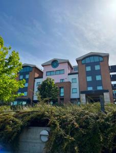 a building with a clock on top of it at don guglielmo panoramic hotel & spa in Campobasso