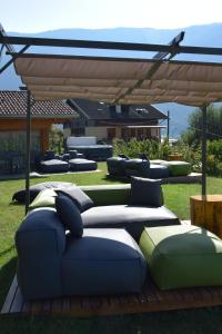 a group of pillows sitting on the grass at Agritur Il Tempo delle Mele in Caldes