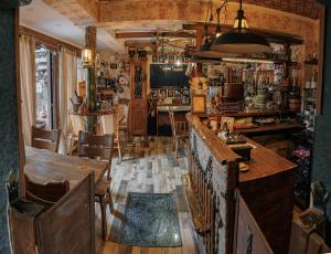 a kitchen with a table and chairs and a dining room at Piano Borracho Boutique Hotel Old Tbilisi in Tbilisi City