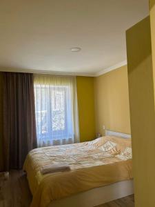 Cama ou camas em um quarto em Telavi