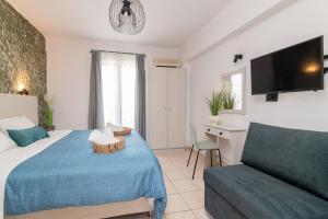 Posteľ alebo postele v izbe v ubytovaní Amarylis Beachfront Studios