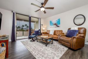 a living room with a couch and a table at White Sands Village#231 in Kailua-Kona