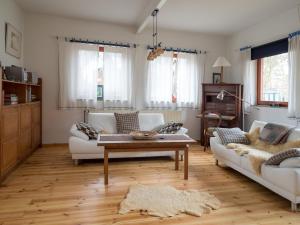 a living room with two couches and a coffee table at Alte Wäscherei in Spiekeroog