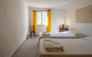 Letto o letti in una camera di Discesa a Mare-Villa Esclusiva Vista Caprera
