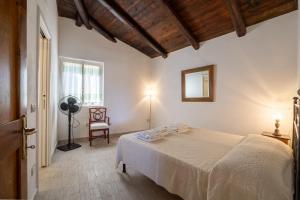 Letto o letti in una camera di Discesa a Mare-Villa Esclusiva Vista Caprera