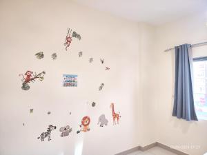 a childs room with stickers on the wall at New! Relaxing Family Home just 8 mins to waterfront in Sharjah