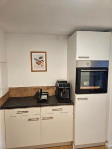 Kuchyň nebo kuchyňský kout v ubytování Cozy Reifnitz-mit Seezugang