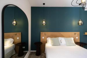 Postel nebo postele na pokoji v ubytování Hôtel Barnea