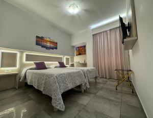 Ένα ή περισσότερα κρεβάτια σε δωμάτιο στο B&B Holiday Tropea