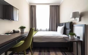 Postel nebo postele na pokoji v ubytování Hotel Impresja