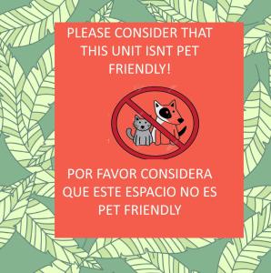 a sign that says please consider that this unit isnt pet friendly at Anana Coliving in Playa del Carmen
