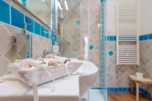 a bathroom with a sink and a shower at La rosa dei venti in Villasimius